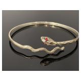 Vintage silver tone snake bangle w/ red gem eyes