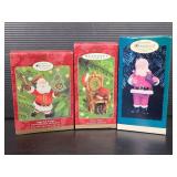 Three Hallmark Santa & santas chair ornaments