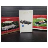 Three Hallmark automobile ornaments