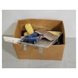 Box of assorted paint supplies