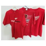 Three red Detroit Red Wings t-shirts