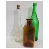Three vintage glass bottles