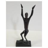 Carved wood dancing man statue