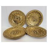 Four embossed metal wall plates