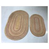 Matching pair of vintage oval woven rugs