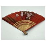 Vintage 1950s red painted folding hand fan