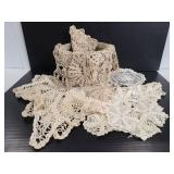 Vintage crocheted doilies with basket