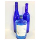 Threen blue glass bottles
