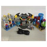 Three large Imaginext super hero play sets