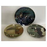 Three ceramic cow plates