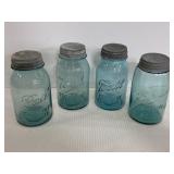 Four vintage blue glass Ball jars w/ lids