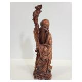 Carved wood man statue