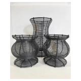 Trio of metal pillar candle holders