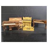 Collection of wood and plastic pianos
