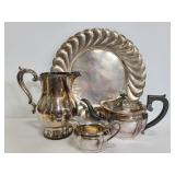 Four stamped silver plate dishes