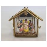 Nativity ornament in glass stable