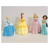Four porcelain disney princess figurines