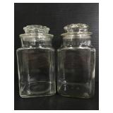 Two glass canisters with lids