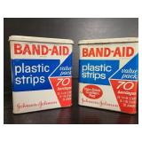 Two vintage Bandaid metal tins