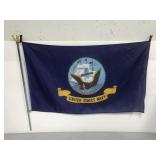 US Navy flag on patriotic pole