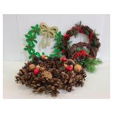 Four small holiday wreaths