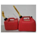 Two plastic gas cans with spouts
