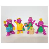Four vintage 1990s Barney figures