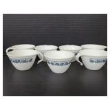 Seven vintage stacking Corelle coffee mugs