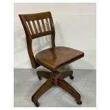 Antique rolling wood bankers desk chair