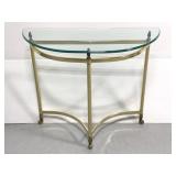 Glass top brass body console table