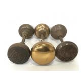 Three orange antique door knob handle sets