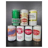 Seven vintage beer cans