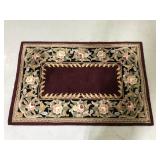 Burgundy floral indoor rug