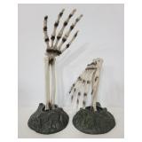 Pair of plastic halloween skeleton hands on stands