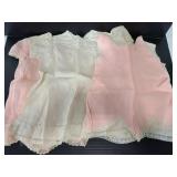 2 pink & 2 cream colored baby/doll dresses