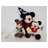 Three mickey mouse plushes