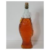 Glass fish bottle with contents