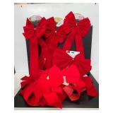 Ten decorative large red Christmas bows