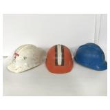 Trio of vintage hard hats