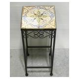 Small metal plant stand with ceramic tile top