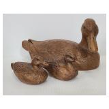 Three carved wood ducks