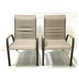 Pair of metal and woven seat patio chairs
