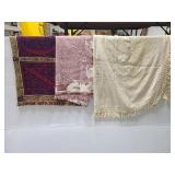 Three throw blankets