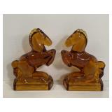 Pair of vintage amber glass horse bookends
