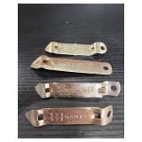Four vintage metal bottle openers