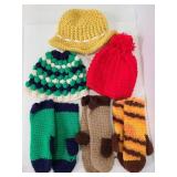 Three knocked Hats & pairs of mittens
