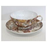 Asian inspired tea cup with saucer