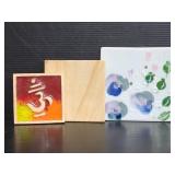 Three decorative ceramic tiles