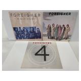 Three Foreigner vinyl records