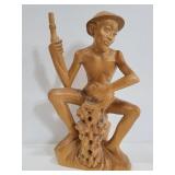 Vintage carved wood Bali man with fish statue